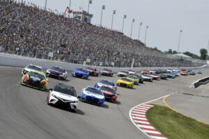 A pace car leads NASCARS down to front stretch of World Wide Technology Raceway.